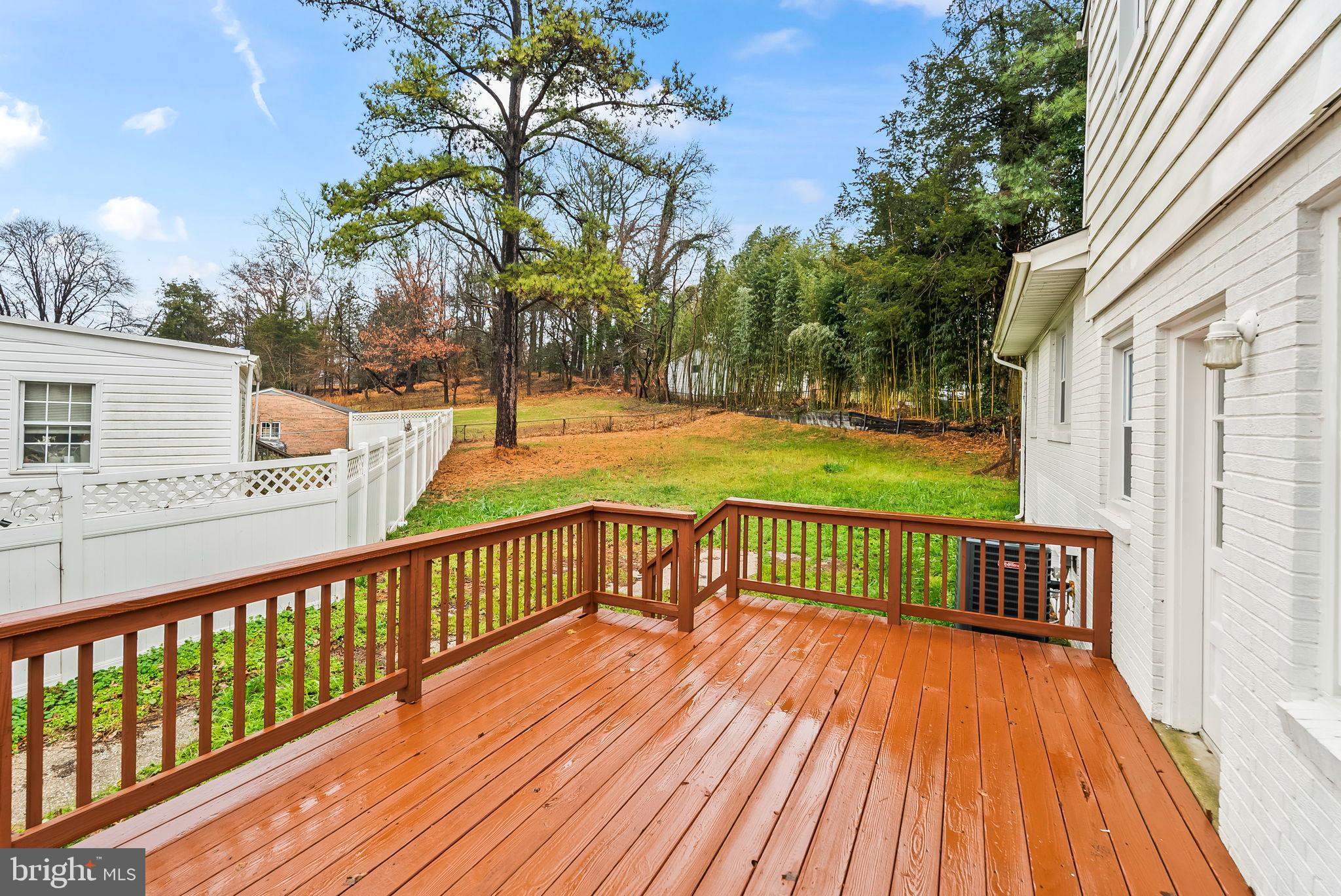 4302 Henderson Road Temple Hills, MD 20748 - Photo 29 of 33 a view of a wooden deck with a yard