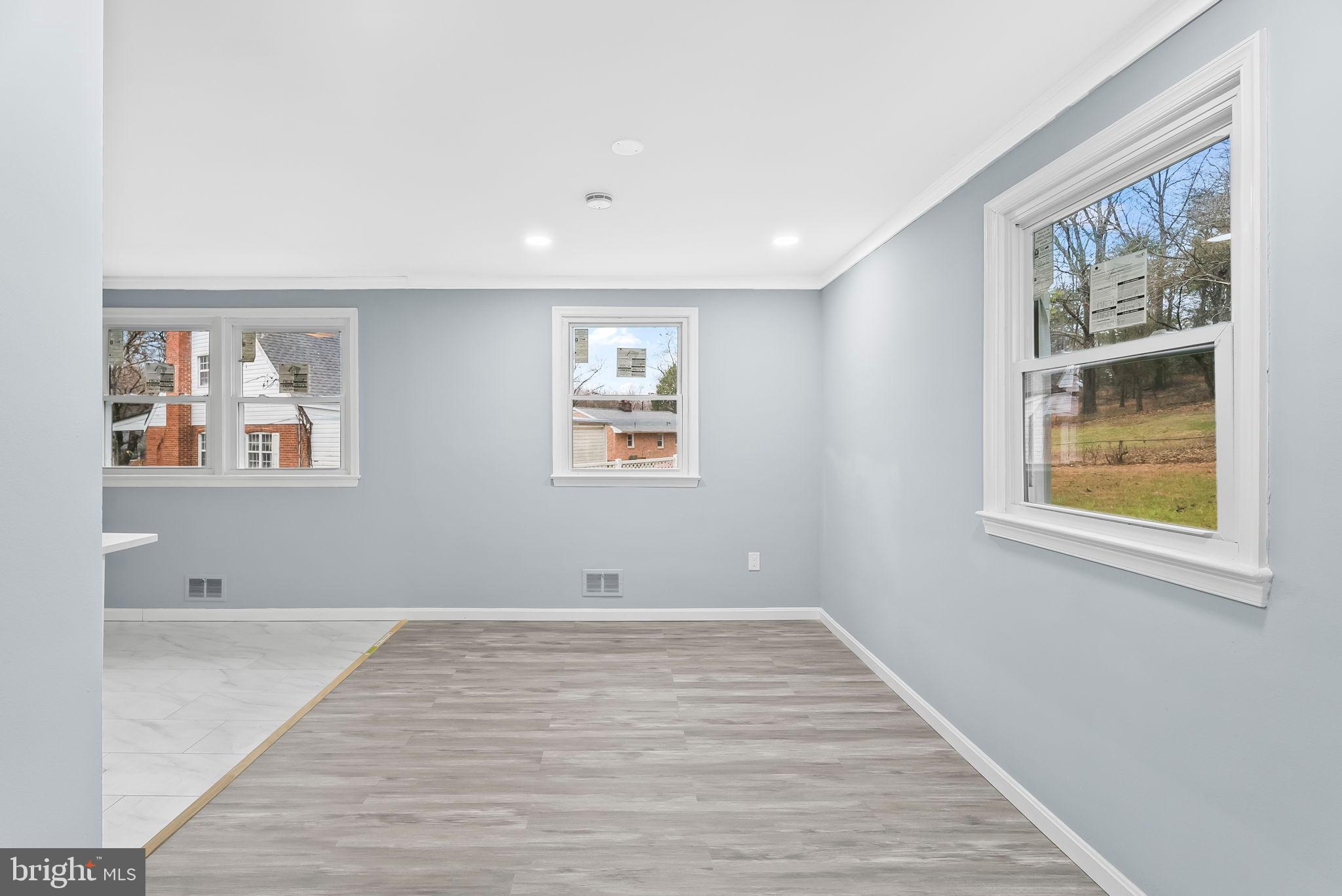 4302 Henderson Road Temple Hills, MD 20748 - Photo 8 of 33 a view of room with window and wooden floor