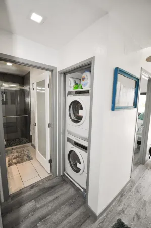 a view of a hallway with washer and dryer