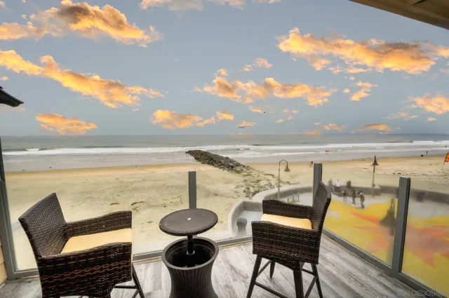 a view of a balcony with an ocean view