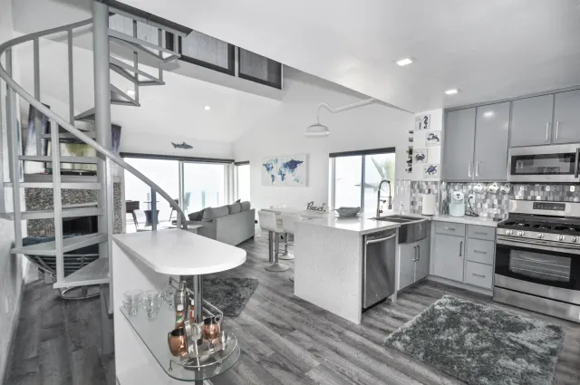 a kitchen with furniture and a stove