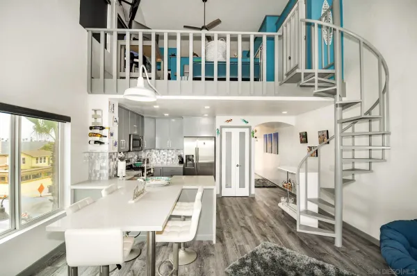 a dining room with furniture and wooden floor