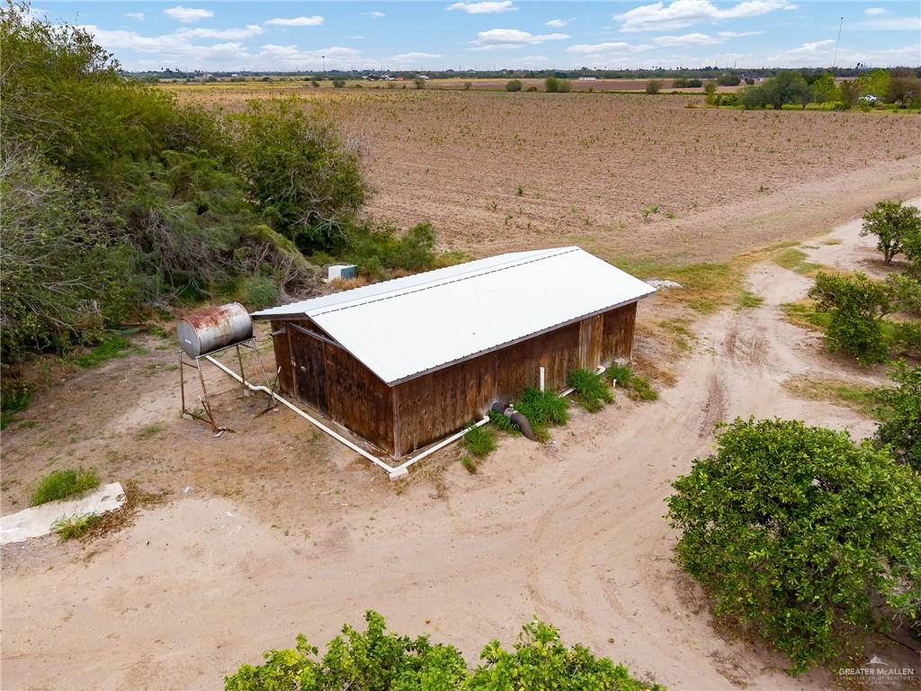 0 East Cantu Road North Santa Rosa, TX 78593 - Photo 4 of 9 an aerial view of a house with a lake view