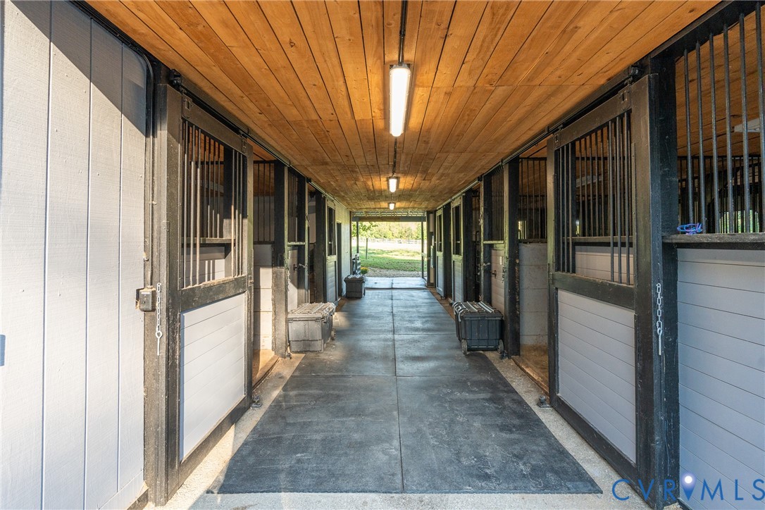 639 Sandy Point Road West Point, VA 23181 - Photo 19 of 45 Bright center aisle. A fly spray system serves all