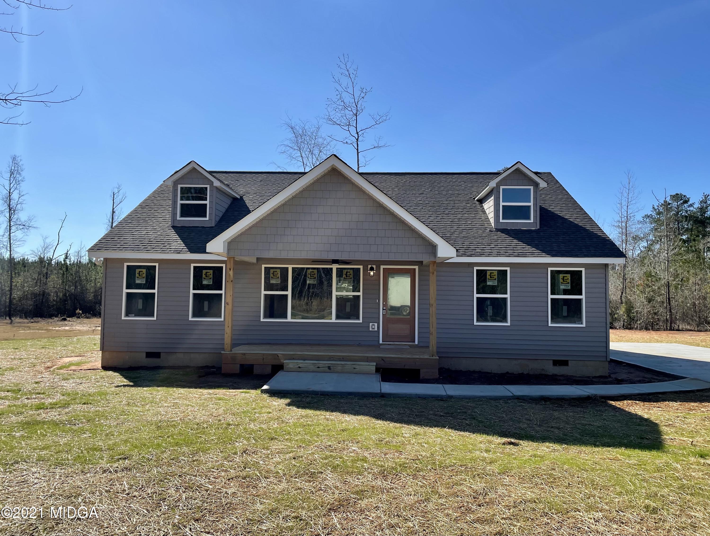 677 Unionville Road Barnesville, GA 30204 - Photo 1 of 1 a front view of a house with a yard