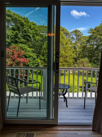 a view from deck with patio