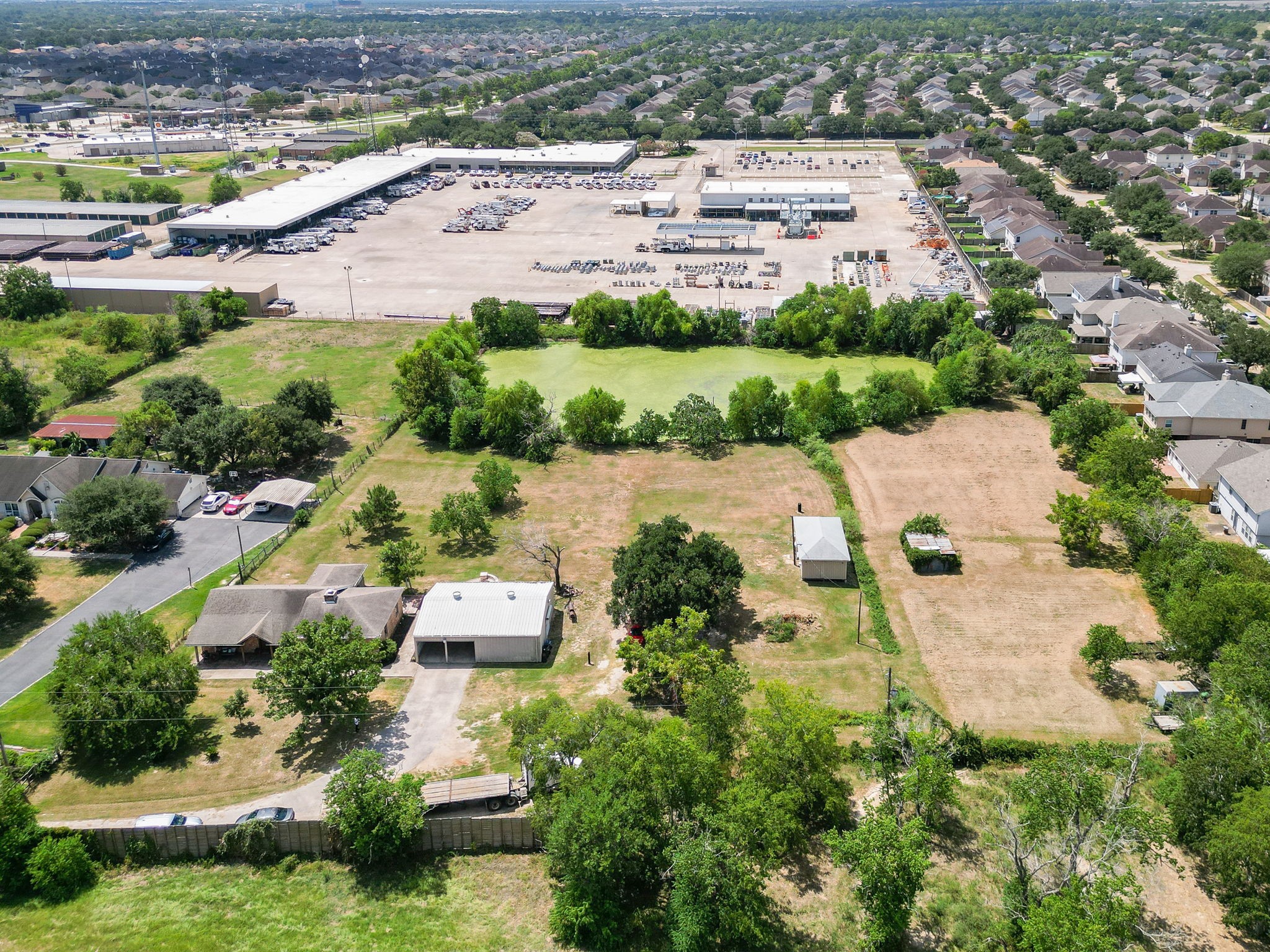 16119 Cypress Rosehill Road Cypress, TX 77429 - Photo 2 of 47 an aerial view of a house with a yard and lake view