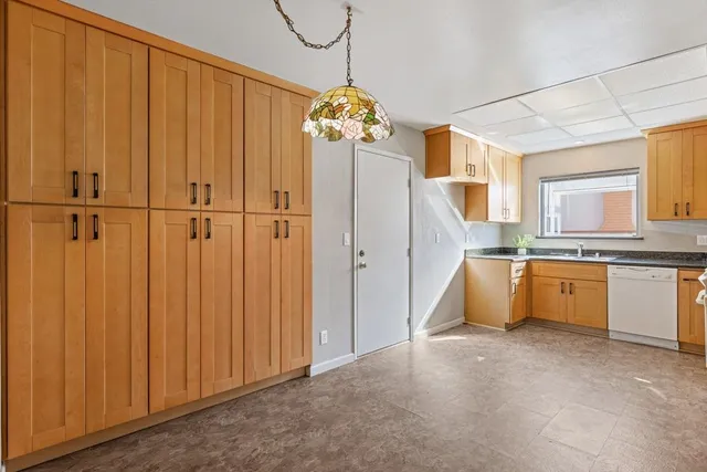 a view of a kitchen with cabinet and outdoor space