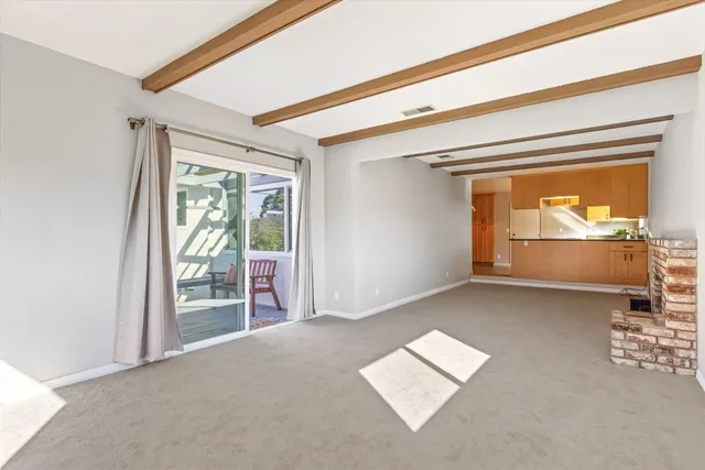 a view of an empty room and window