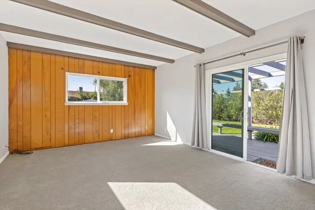 a view of a room with a large window