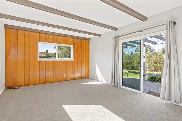 a view of a room with a large window