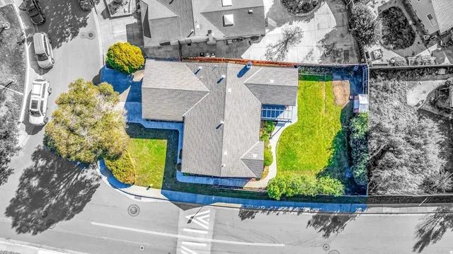 an aerial view of a house with a swimming pool