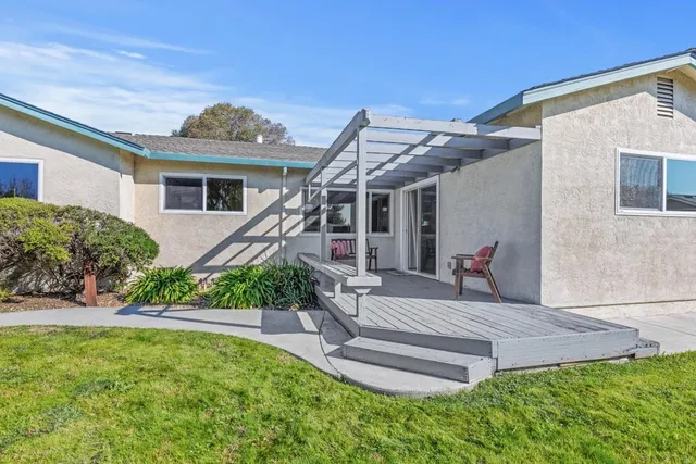 a front view of house with yard and outdoor seating