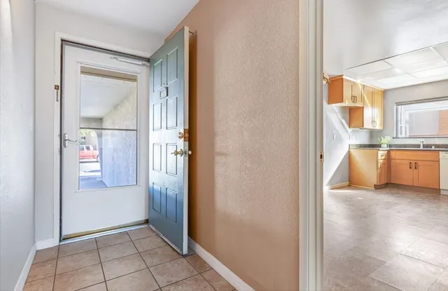a view of a kitchen from the hallway