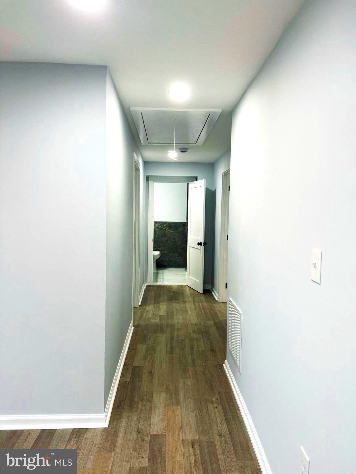 203 Henson Road Glen Burnie, MD 21060 - Photo 12 of 44 a view of a hallway with wooden floor