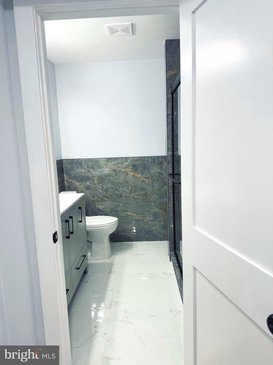 203 Henson Road Glen Burnie, MD 21060 - Photo 16 of 44 a bathroom with a toilet and a shower