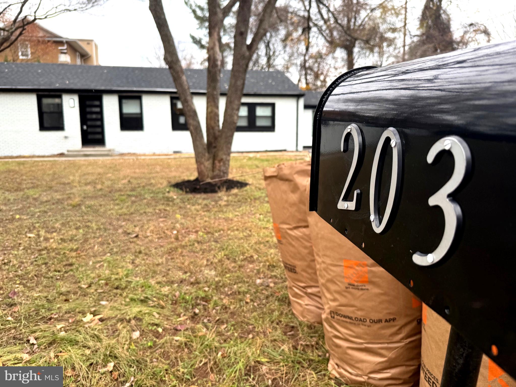 203 Henson Road Glen Burnie, MD 21060 - Photo 2 of 44 a front view of a house with parking
