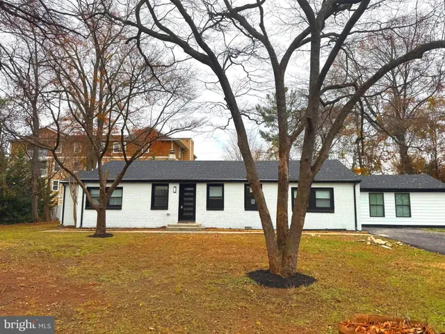 a front view of a house with parking space