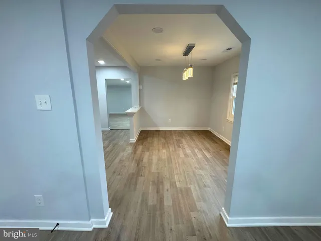 a kitchen with a sink and a stove top oven