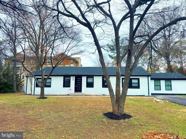 a front view of a house with yard