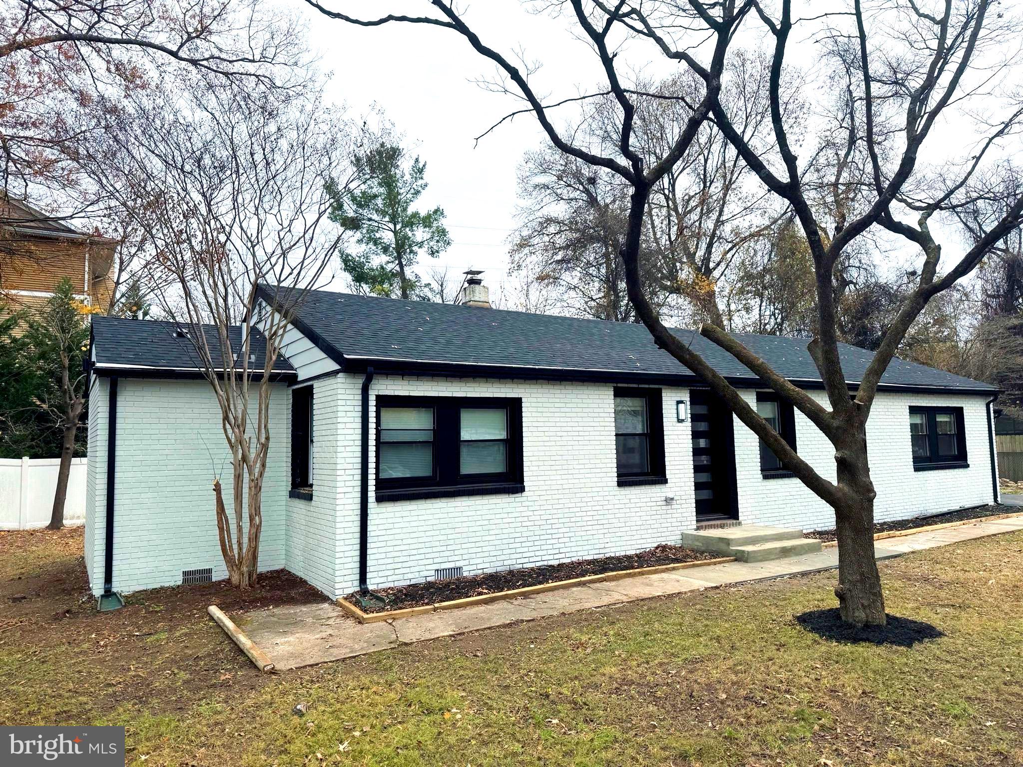 203 Henson Road Glen Burnie, MD 21060 - Photo 7 of 44 a house with trees in front of it
