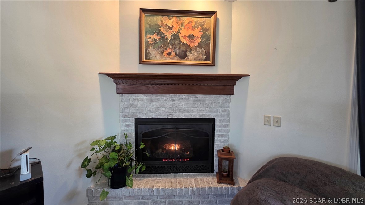 30643 Magnolia Road Gravois Mills, MO 65037 - Photo 16 of 58 Gather around the fireplace