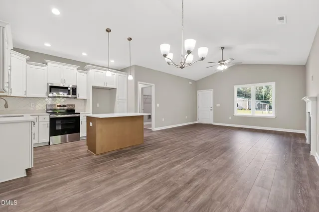 a view of kitchen and window with wooden floor