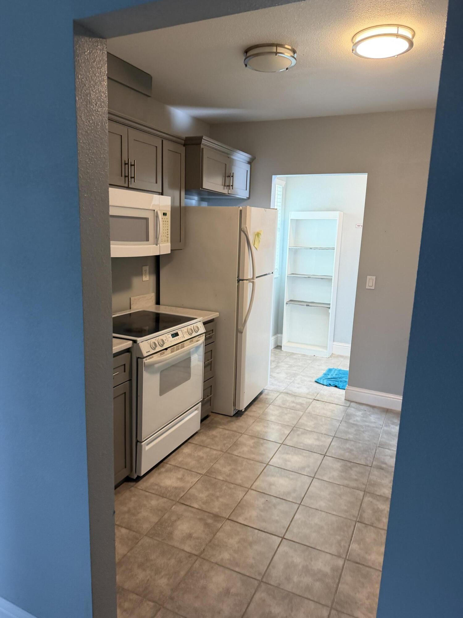 6200 Westside Road Redding, CA 96001 - Photo 26 of 50 a kitchen with a stove and a refrigerator