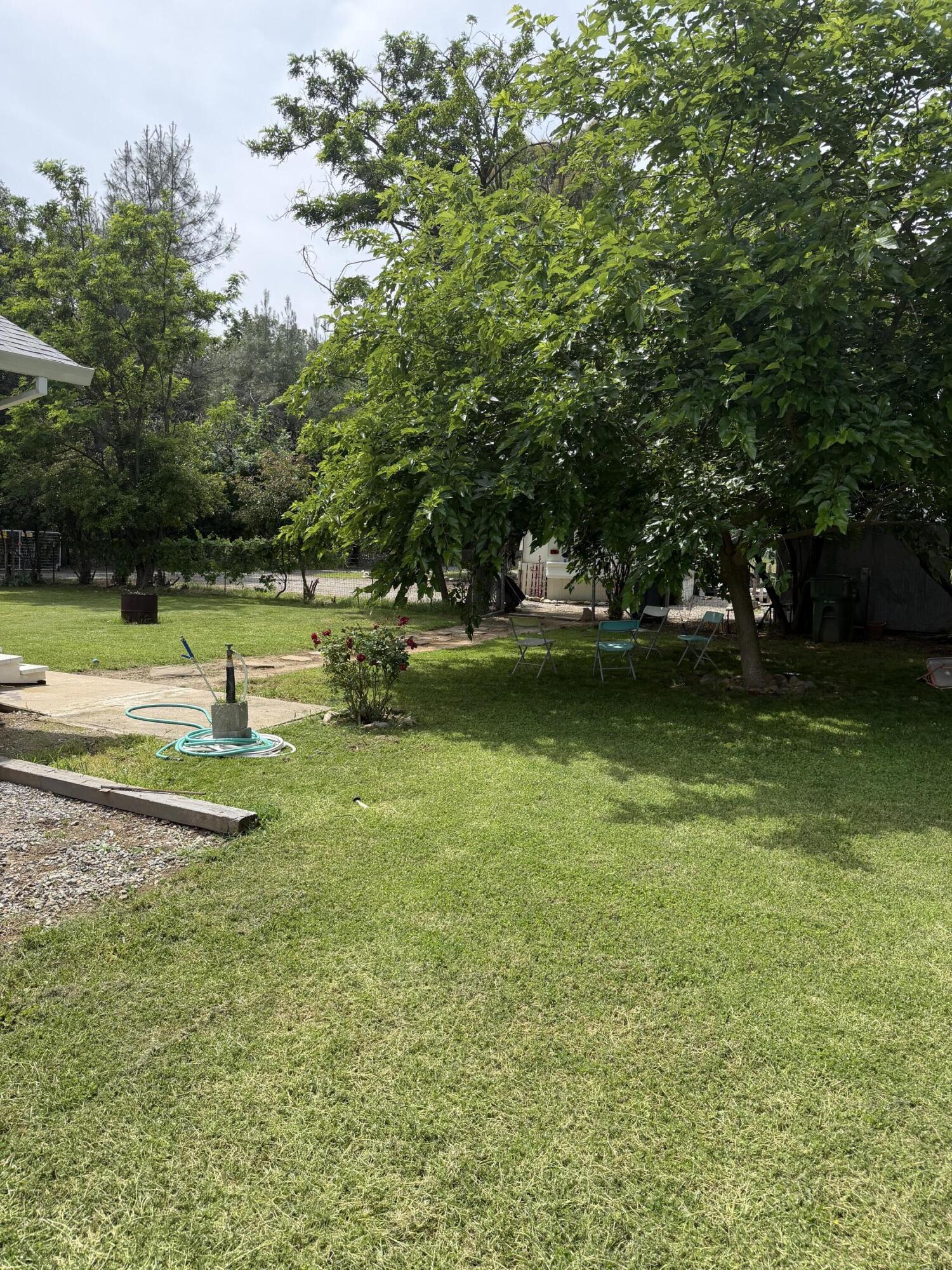 6200 Westside Road Redding, CA 96001 - Photo 34 of 50 a view of a swimming pool with a yard