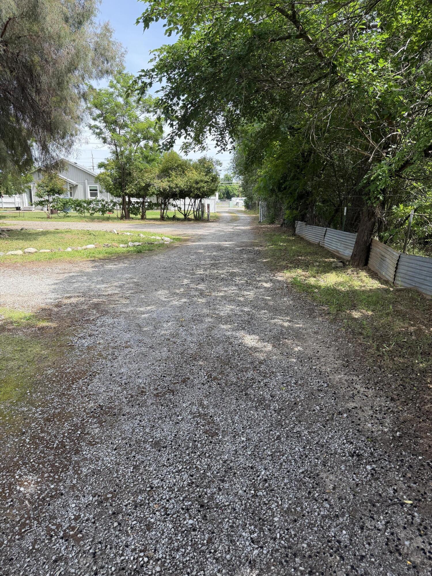 6200 Westside Road Redding, CA 96001 - Photo 39 of 50 a view of a house with a big yard and large trees