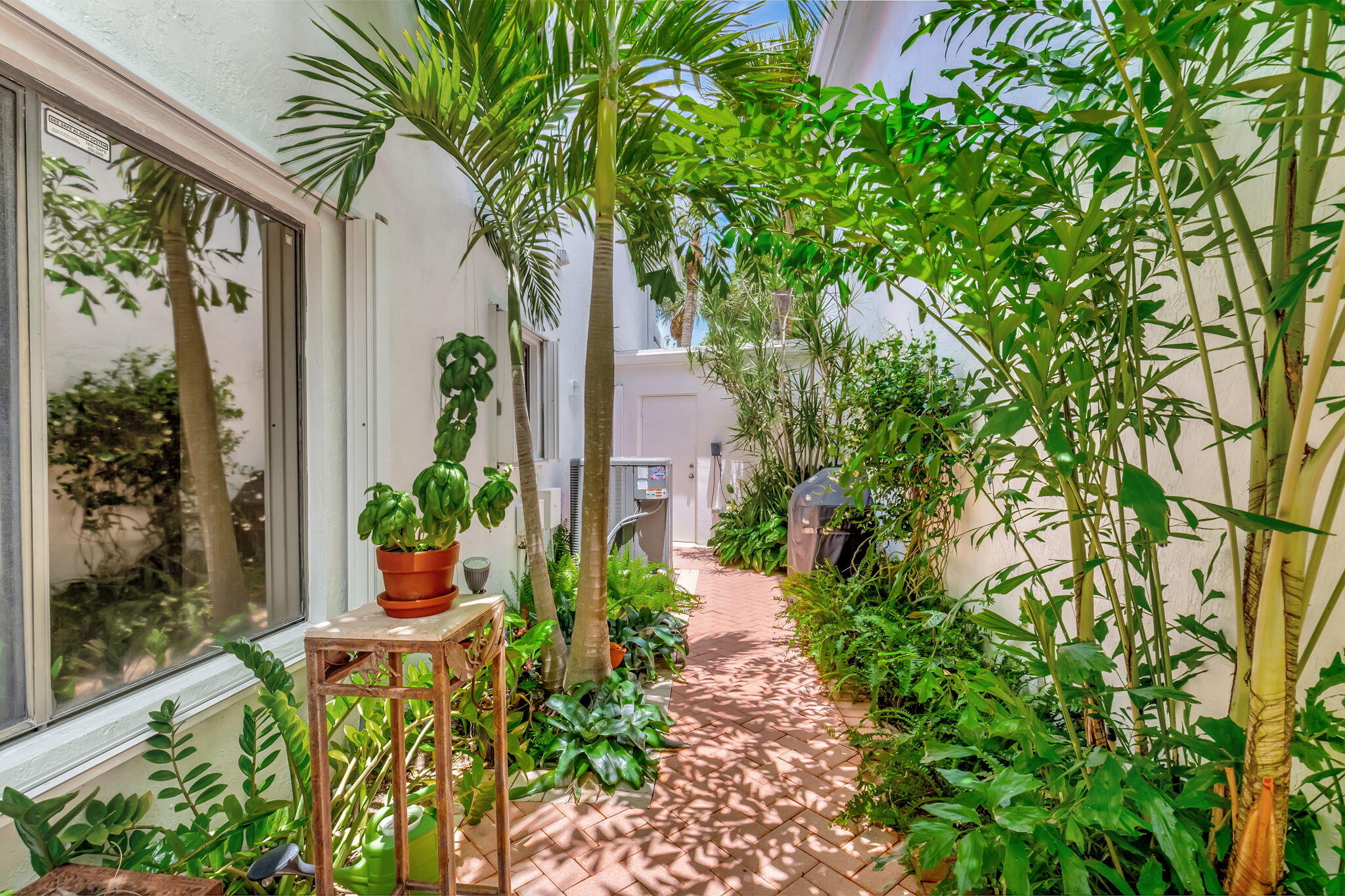 21700 Cromwell Circle Boca Raton, FL 33486 - Photo 28 of 72 LUSHLY LANDSCAPED COURTYAR WITH BBQ AREA