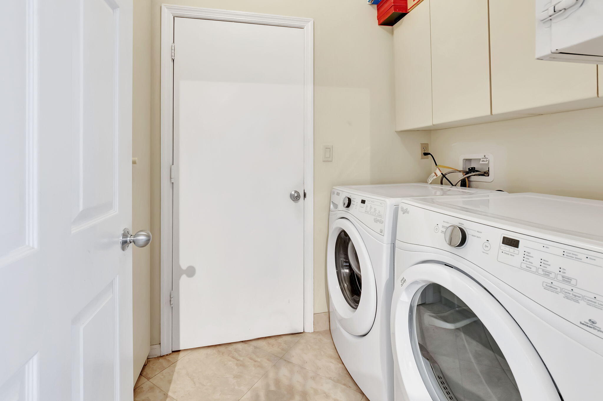 21700 Cromwell Circle Boca Raton, FL 33486 - Photo 36 of 72 LAUNDRY ROOM WITH EXTRA STORAGE