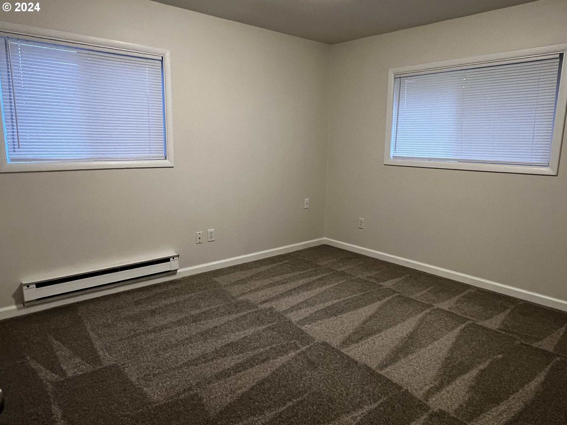 564 Nighthawk Lane Springfield, OR 97477 - Photo 4 of 13 a view of a room with wooden floor and a window