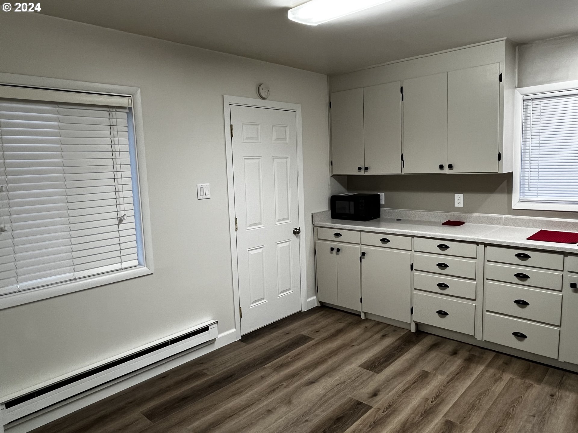 564 Nighthawk Lane Springfield, OR 97477 - Photo 9 of 13 a kitchen with granite countertop white cabinets and white appliances