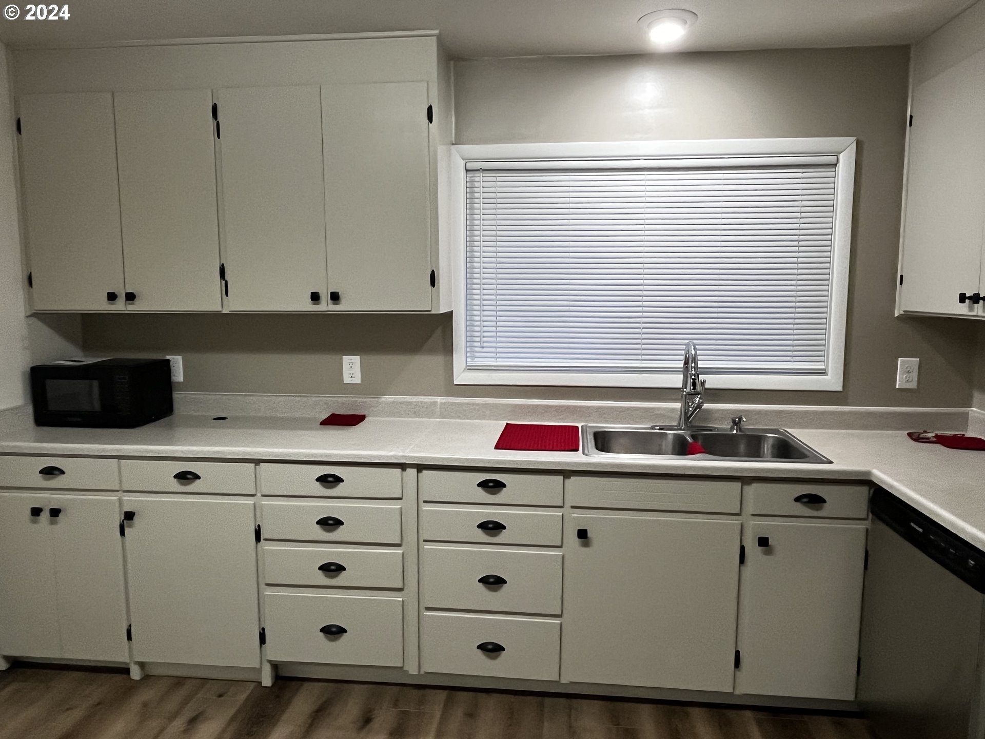 564 Nighthawk Lane Springfield, OR 97477 - Photo 10 of 13 a kitchen with cabinets and white appliances