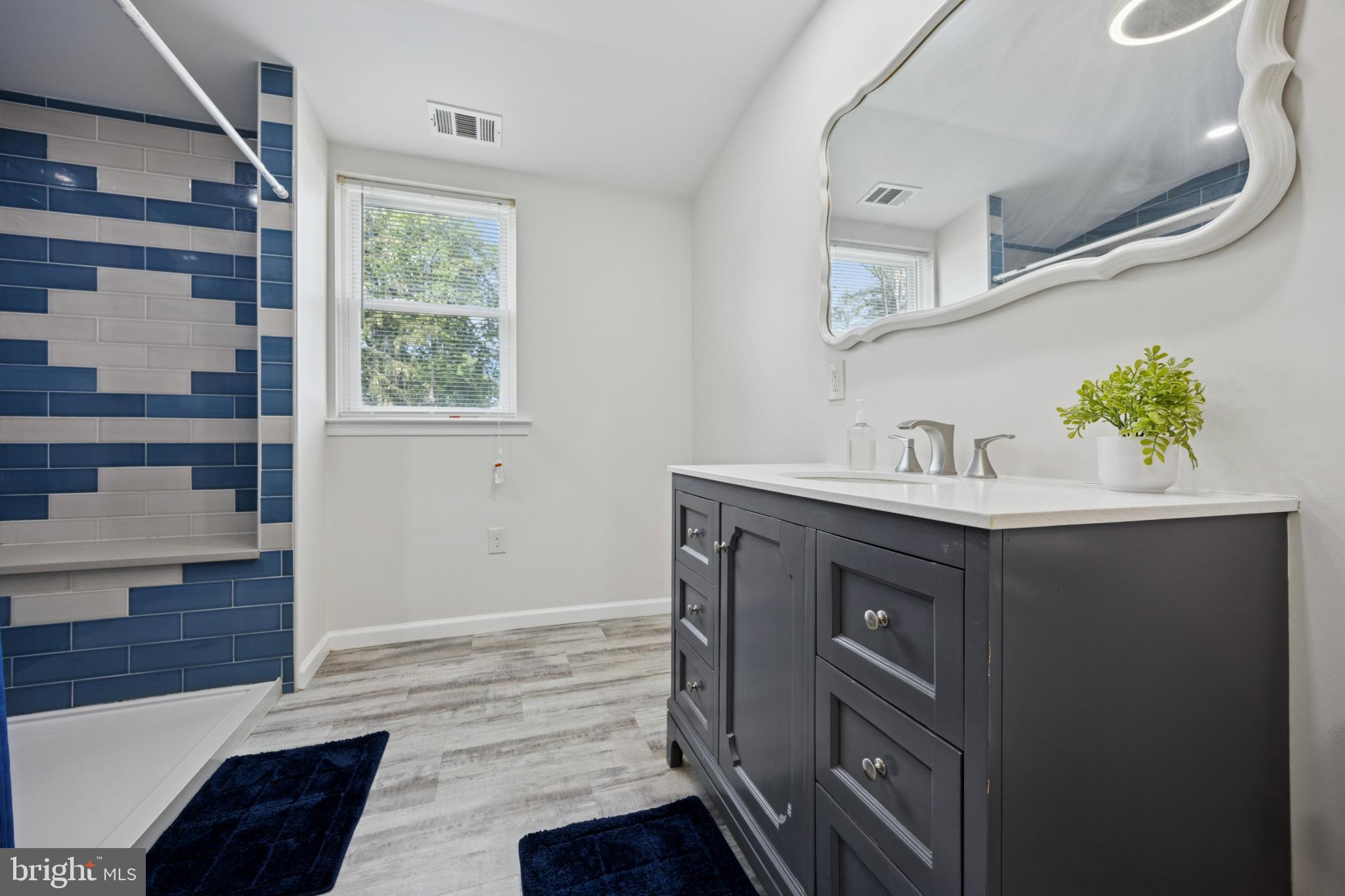 629 Rutland Road Morrisville, PA 19067 - Photo 22 of 25 Modern bathroom with stylish blue accents.