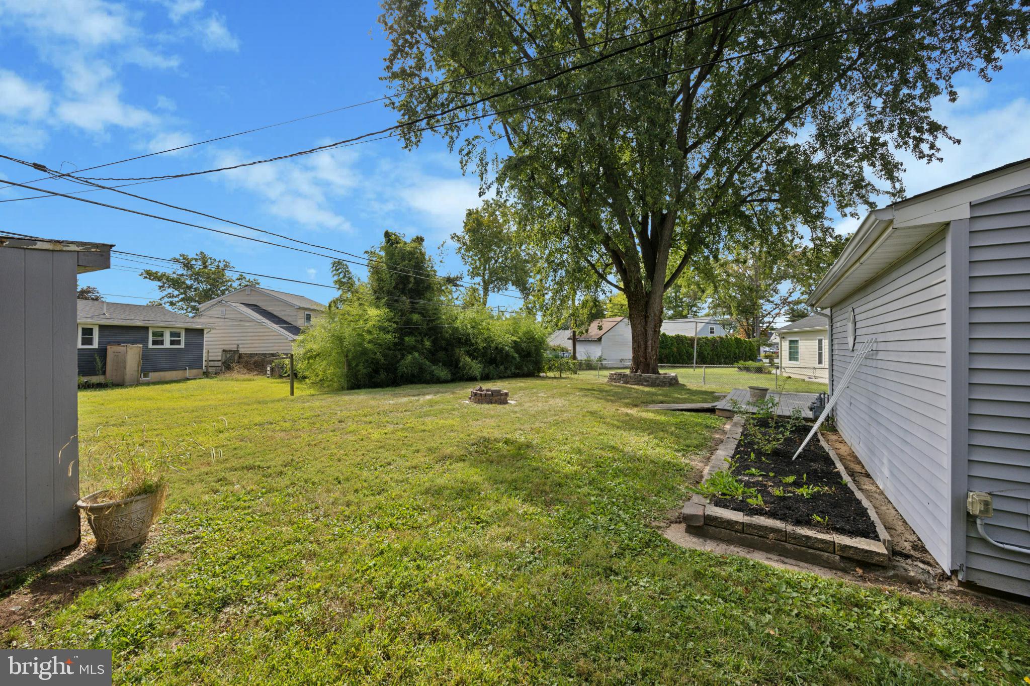 629 Rutland Road Morrisville, PA 19067 - Photo 24 of 25 Spacious backyard with lush greenery.