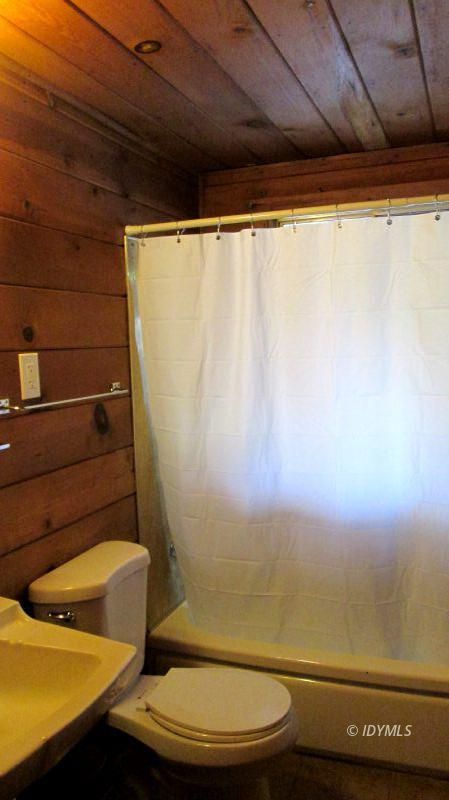 54100 Pine Crest Avenue, Unit 7 Idyllwild, CA 92549 - Photo 4 of 12 a bathroom with a toilet and a sink