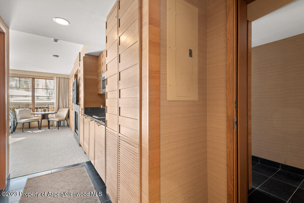 130 Wood Road, Unit 505 & 507 Snowmass Village, CO 81615 - Photo 14 of 35 a view of a hallway with the view of the living room and windows