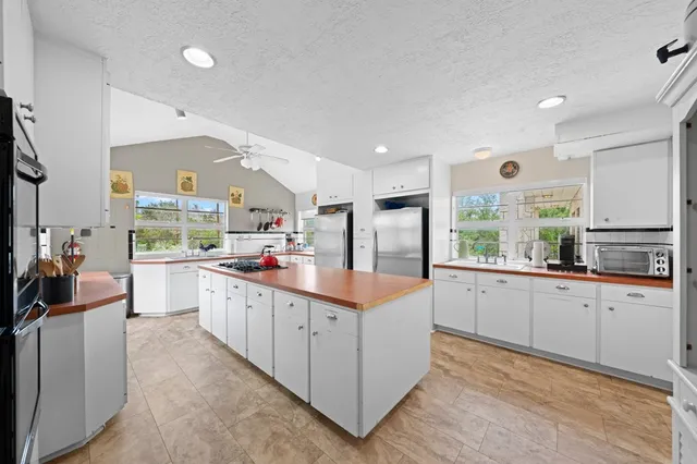 a kitchen with sink cabinets and window