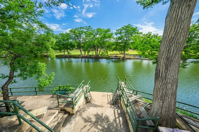 a view of a lake with a garden
