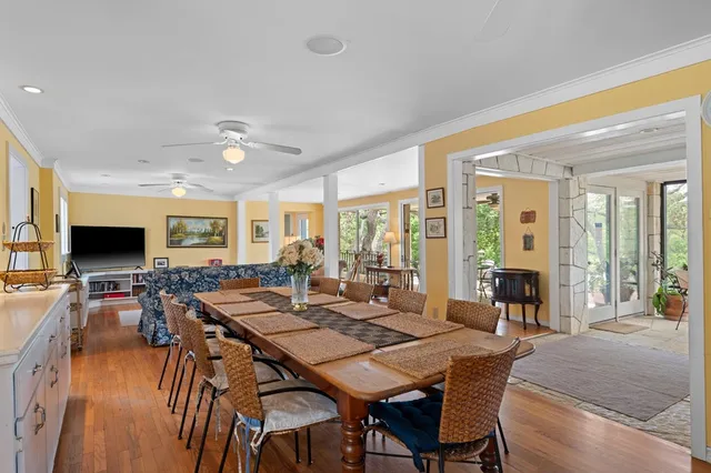 a view of a dining room with furniture window and wooden floor