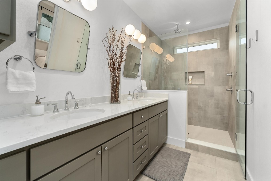 1806 Garden Street, Unit B Austin, TX 78702 - Photo 13 of 24 a bathroom with a double vanity sink mirror and shower