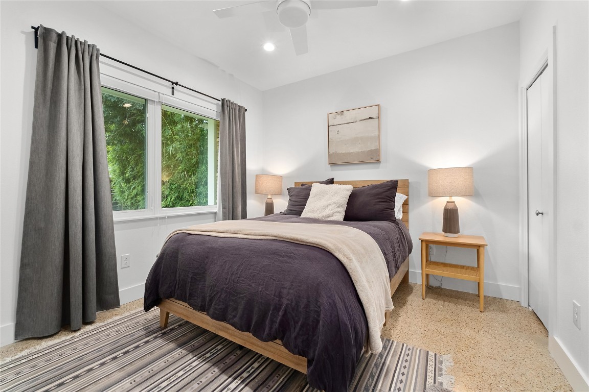 1806 Garden Street, Unit B Austin, TX 78702 - Photo 17 of 24 a bedroom with a bed lamp and window