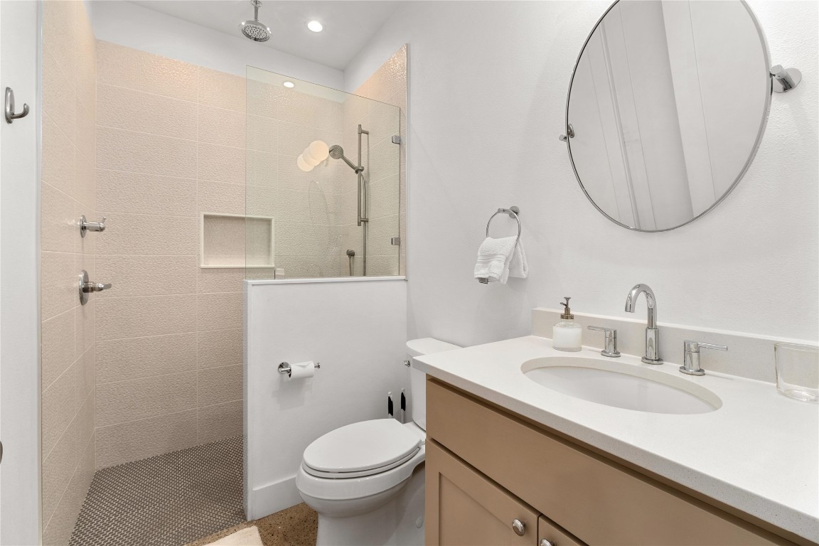 1806 Garden Street, Unit B Austin, TX 78702 - Photo 18 of 24 a bathroom with a sink and a mirror