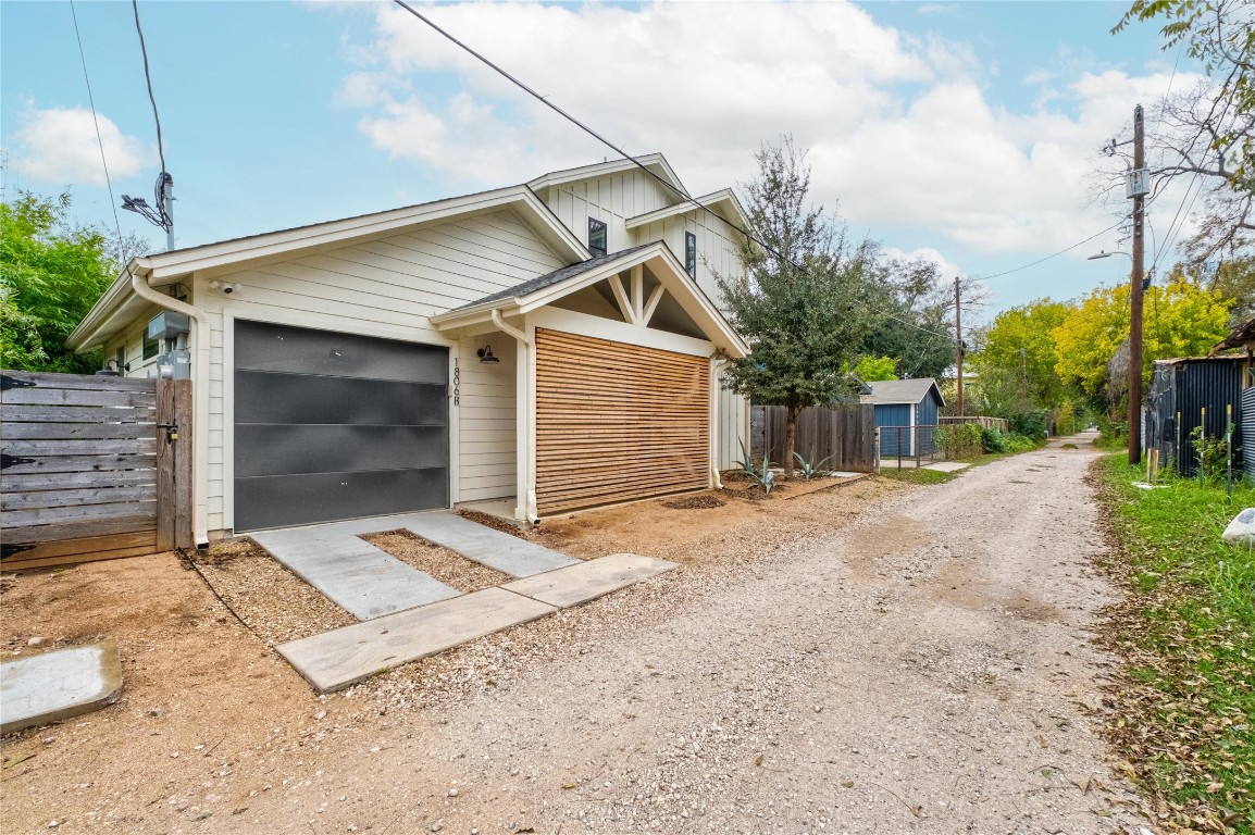 1806 Garden Street, Unit B Austin, TX 78702 - Photo 2 of 24 a front view of a house with a yard and garage