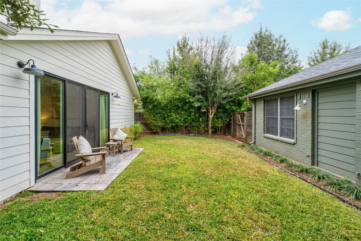 1806 Garden Street, Unit B Austin, TX 78702 - Photo 20 of 24 front view of a house with a yard