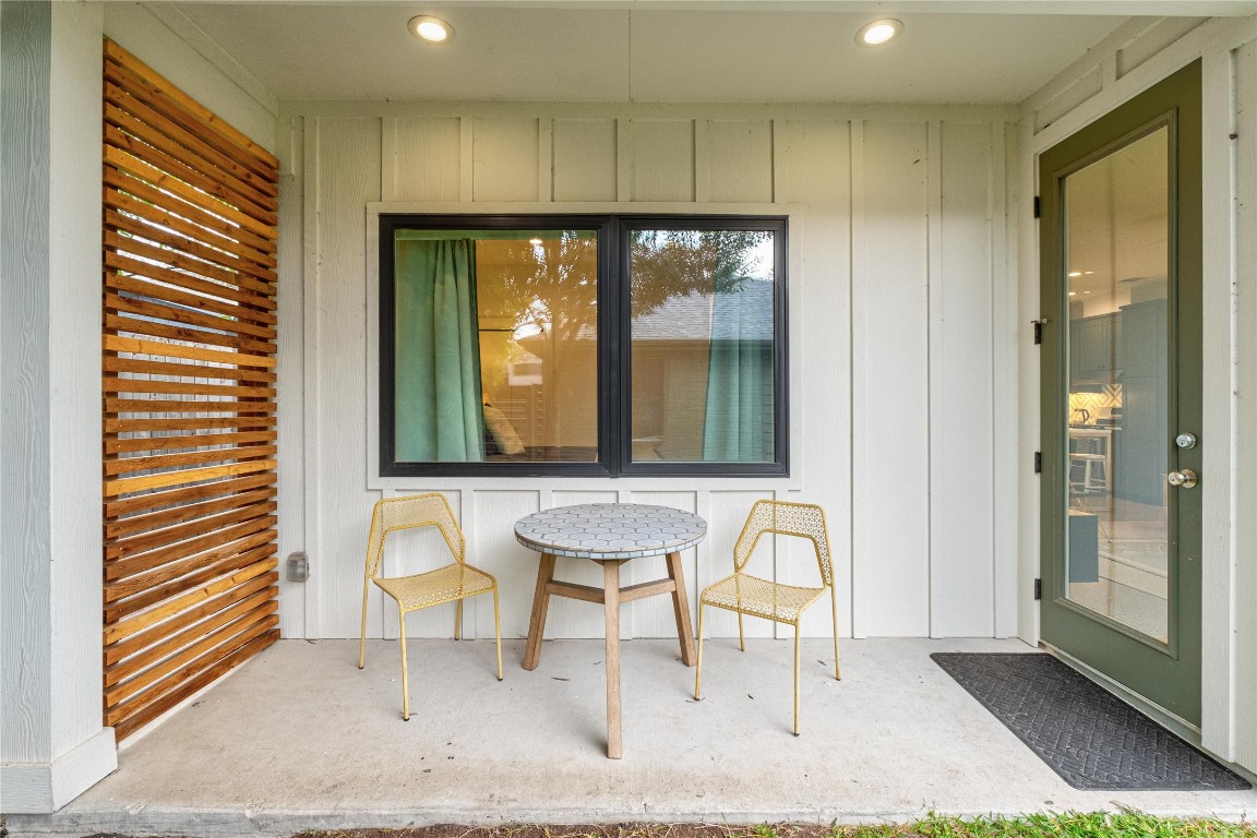 1806 Garden Street, Unit B Austin, TX 78702 - Photo 23 of 24 a view of a hallway with a chair and dining table