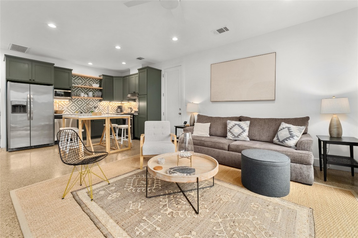 1806 Garden Street, Unit B Austin, TX 78702 - Photo 5 of 24 a living room with furniture a table and kitchen view