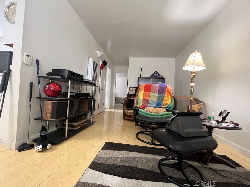 375 Surf Street Morro Bay, CA 93442 - Photo 14 of 25 a living room with furniture a air conditioner and a mirror